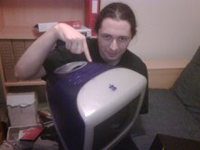 Terence holding a very old iMac