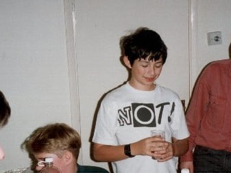 Me aged 13. I have terrible hair. As was the fashion of the time, my t-shirt says "NOT!"