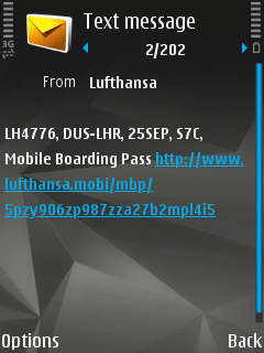 Screenshot of a text message. It has my flight number, date, seat, and a link to a mobile boarding pass.