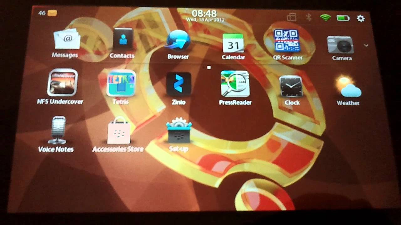 Photo of the BlackBerry Playbook tablet. Lots of icons on the screen.