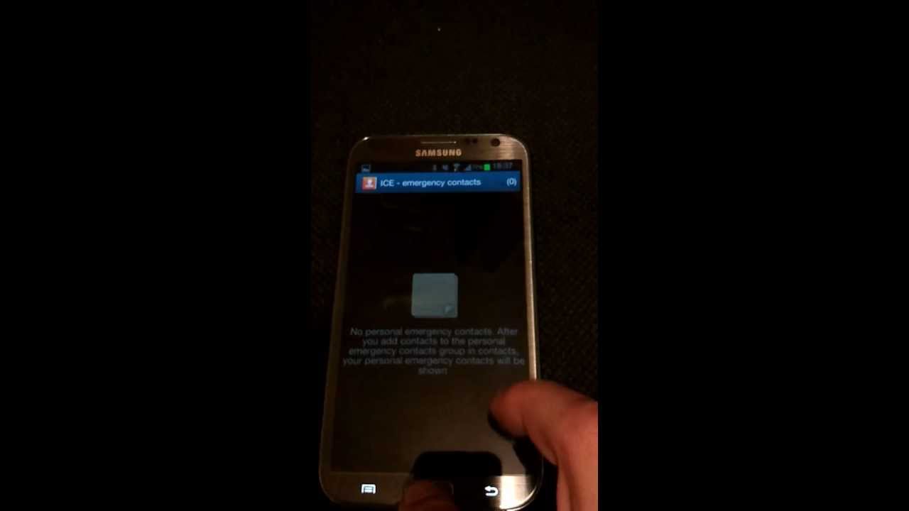 Photo of a finger tapping at a Samsung screen.
