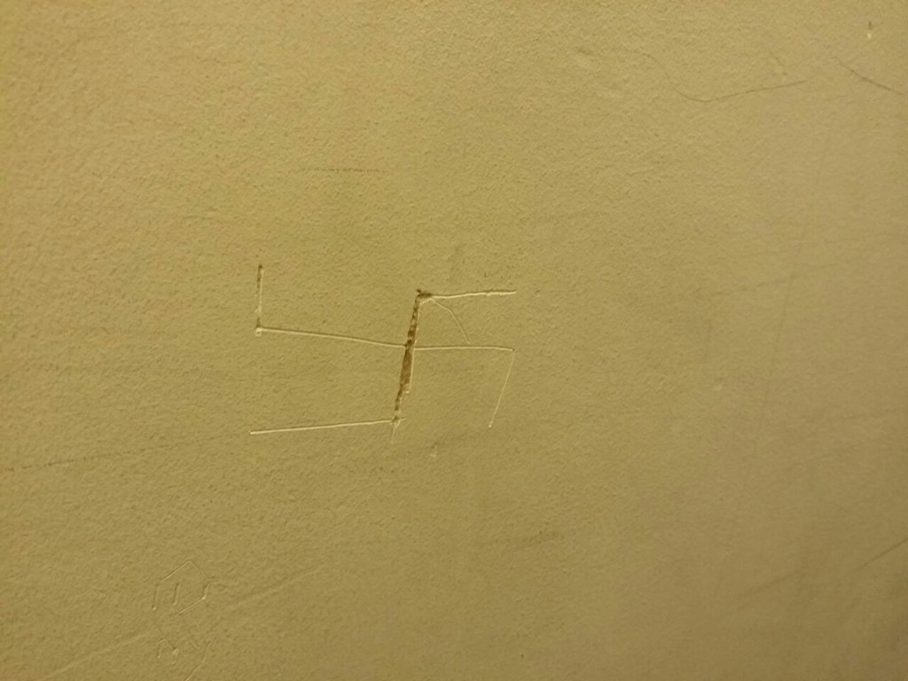 Crappy Swastika Carved Into Wall