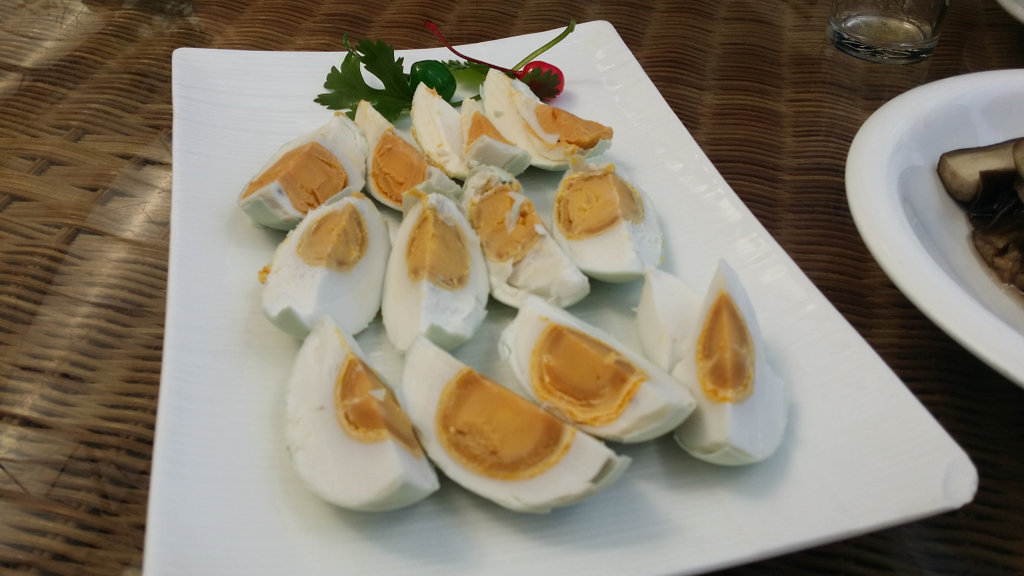 Salted duck eggs, in their shells and quartered