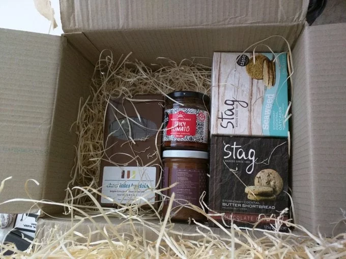 treats inside a box - some jars, boxes, and slabs of chocolate