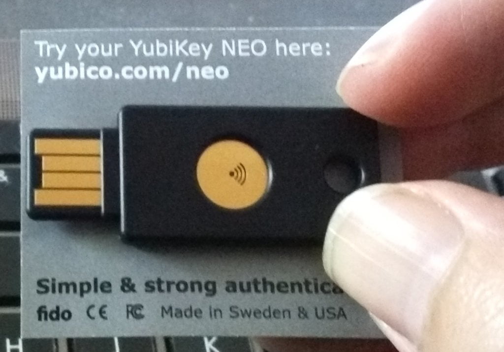 YubiKey Neo - a thumb sized USB device - on cardboard backing