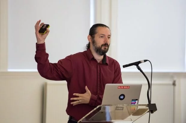 Terence Eden speaking at a conference.