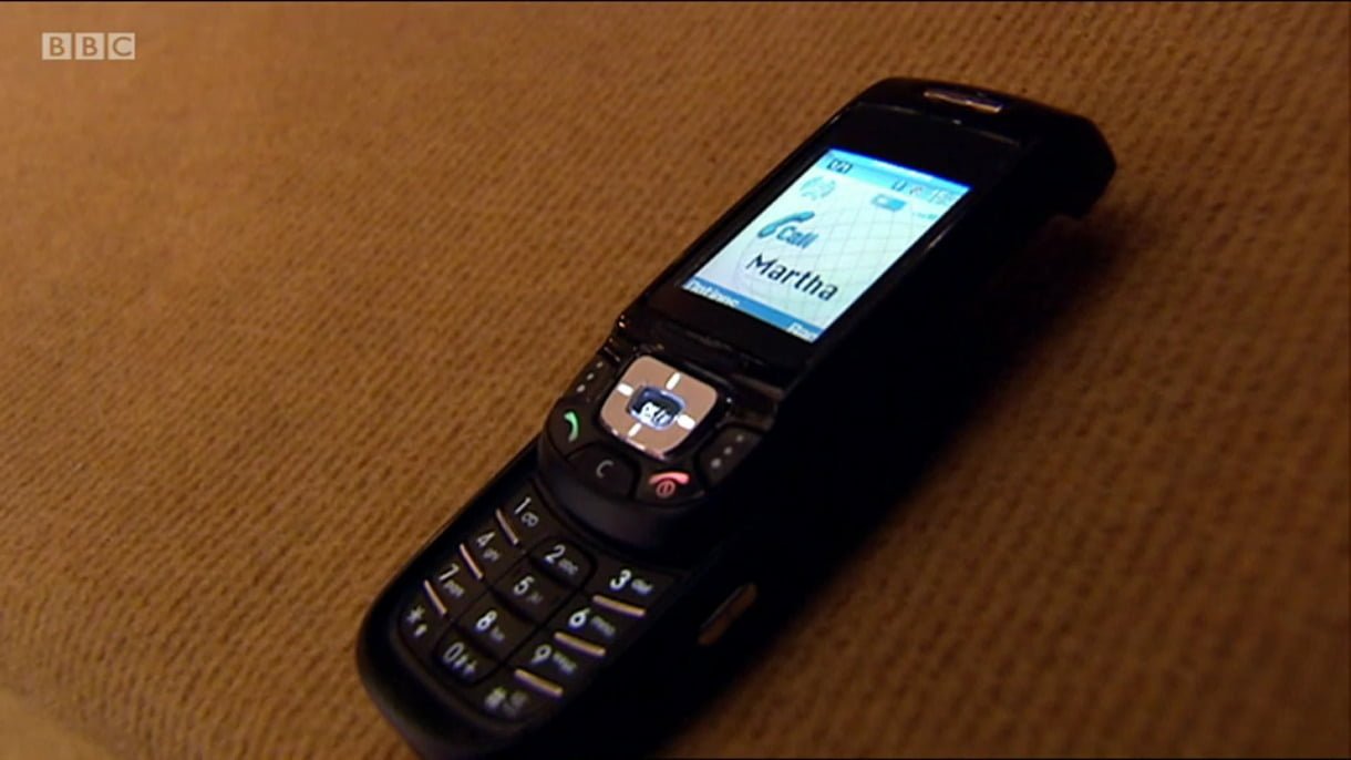 A mobile phone. The display indicates that Martha is calling.