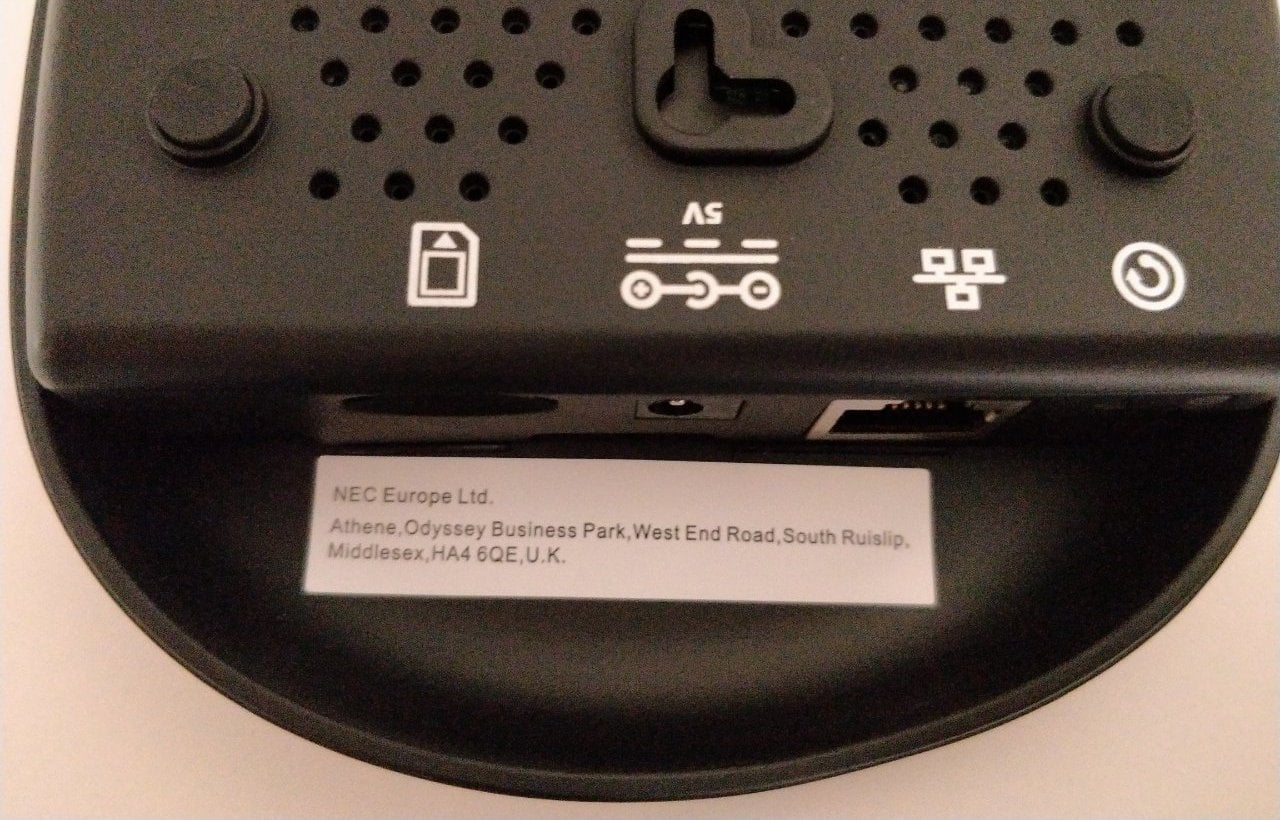 Some anonymous ports on the back of a black plastic device.