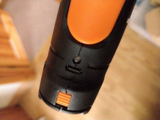 An electric screwdriver. At the bottom is a USB port and an LED.