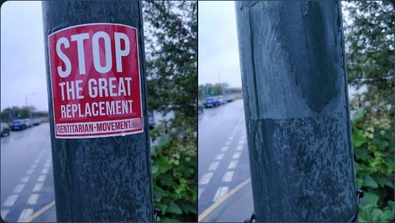 A crappy sticker which says "Stop the great replacement." In the next photo it has been torn off.