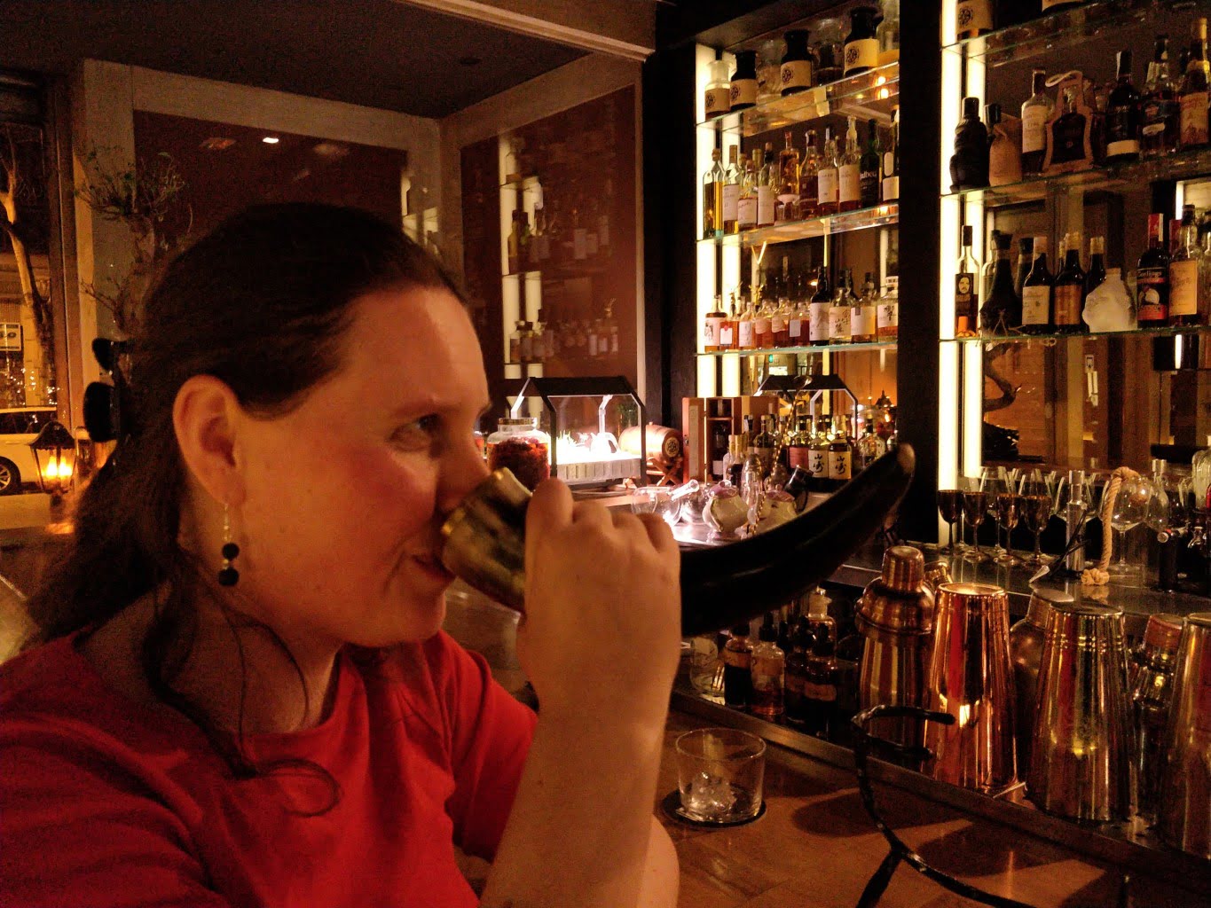 Liz drinking from a Viking horn.