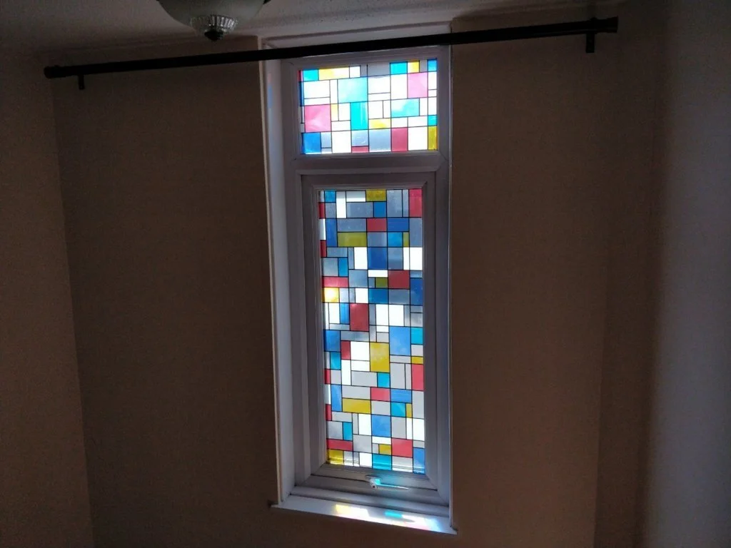 Coloured squares separated by thick black lines. They glow with sunlight.