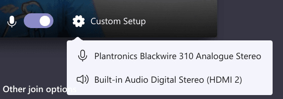 Microsoft Teams lets me choose headset or built in audio device.