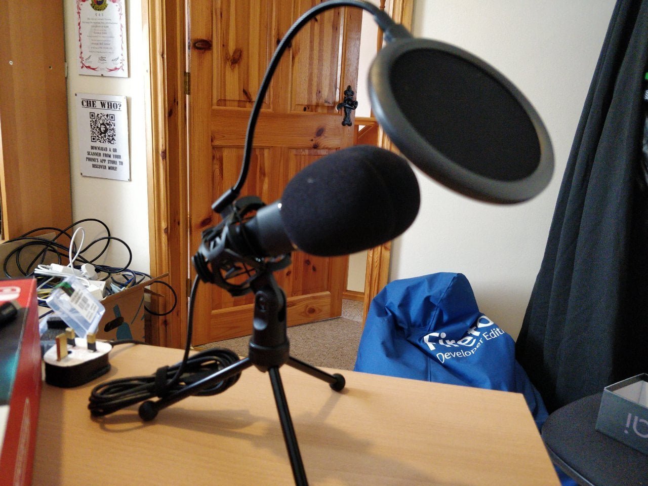 A microphone with a pop shield.