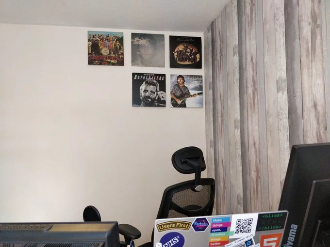 5 albums stuck to the wall.