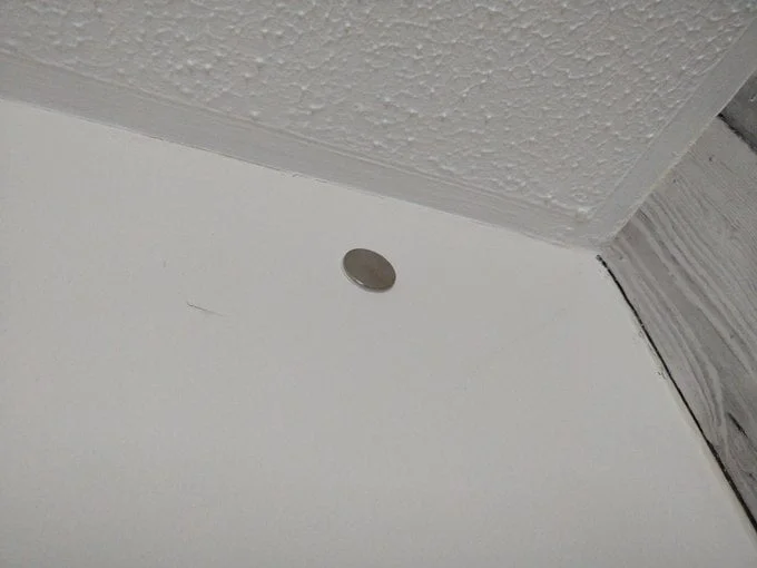 Magnet stuck to wall.