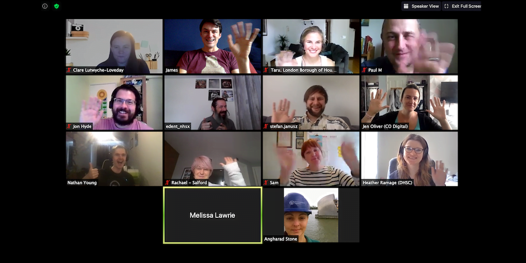 A group of people in a video call waving at their cameras. Each has a name under their video.