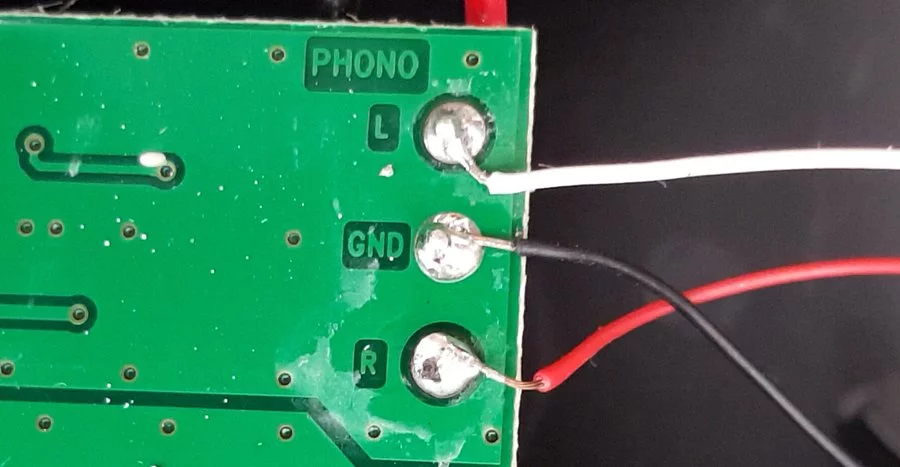 Soldered wires on a cirvuit board.