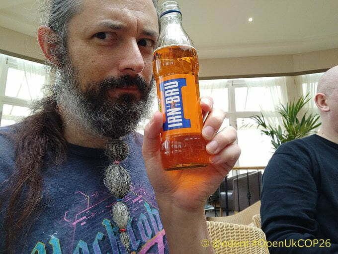 Me holding a bottle of Irn Bu.