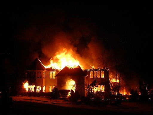 Photo of a house engulfed in flames. Photo taken by Wikimedia user LukeBam06.