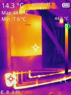 Heat radiates from the pipes of a gas boiler.