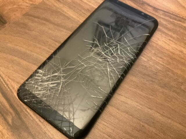 A Samsung with a smashed screen.