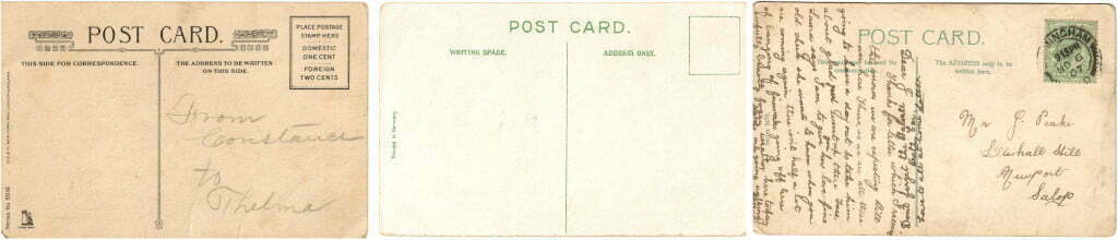 Back of three postcards. One of which has tiny cursive handwriting on it.