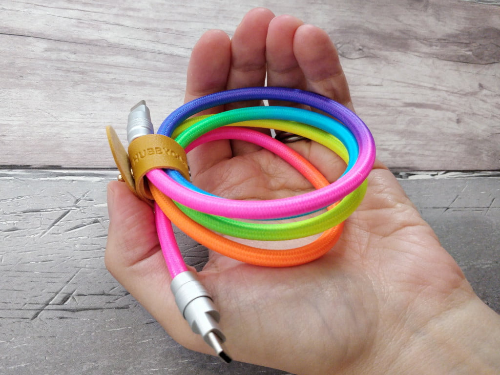 A braided nylon cable with multiple colours and silver ends.