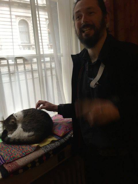 Blurry photo of me and a cat. Taken inside Number 10.