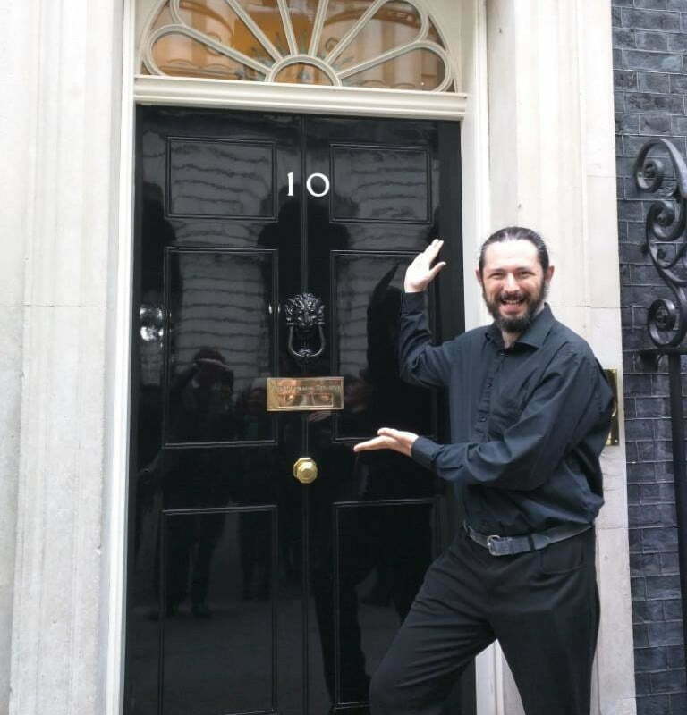 Photo of me doing a silly pose outside Number 10 Downing Street.