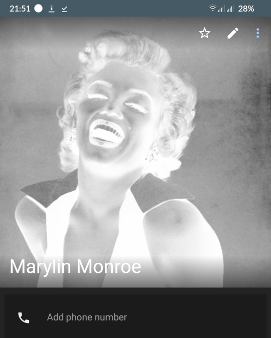 Monochrome photo of Marylin Monroe. The colours have been inverted and it looks rubbish.