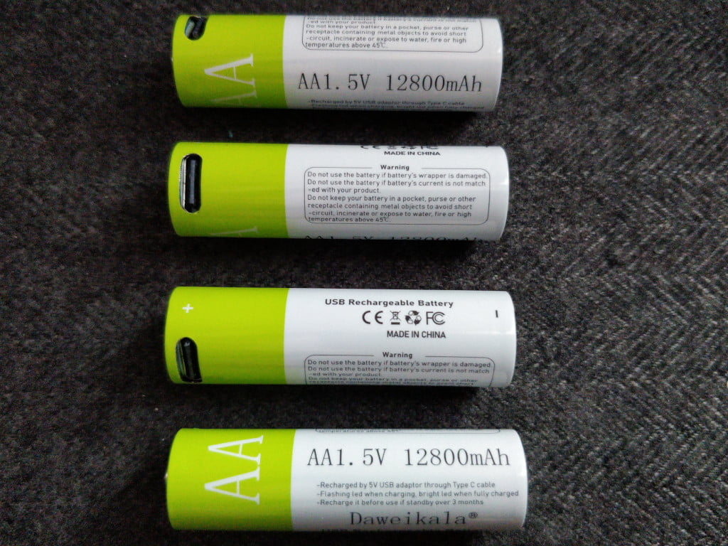 Four AA batteries in a row. They have USB-C receptacles near the top.