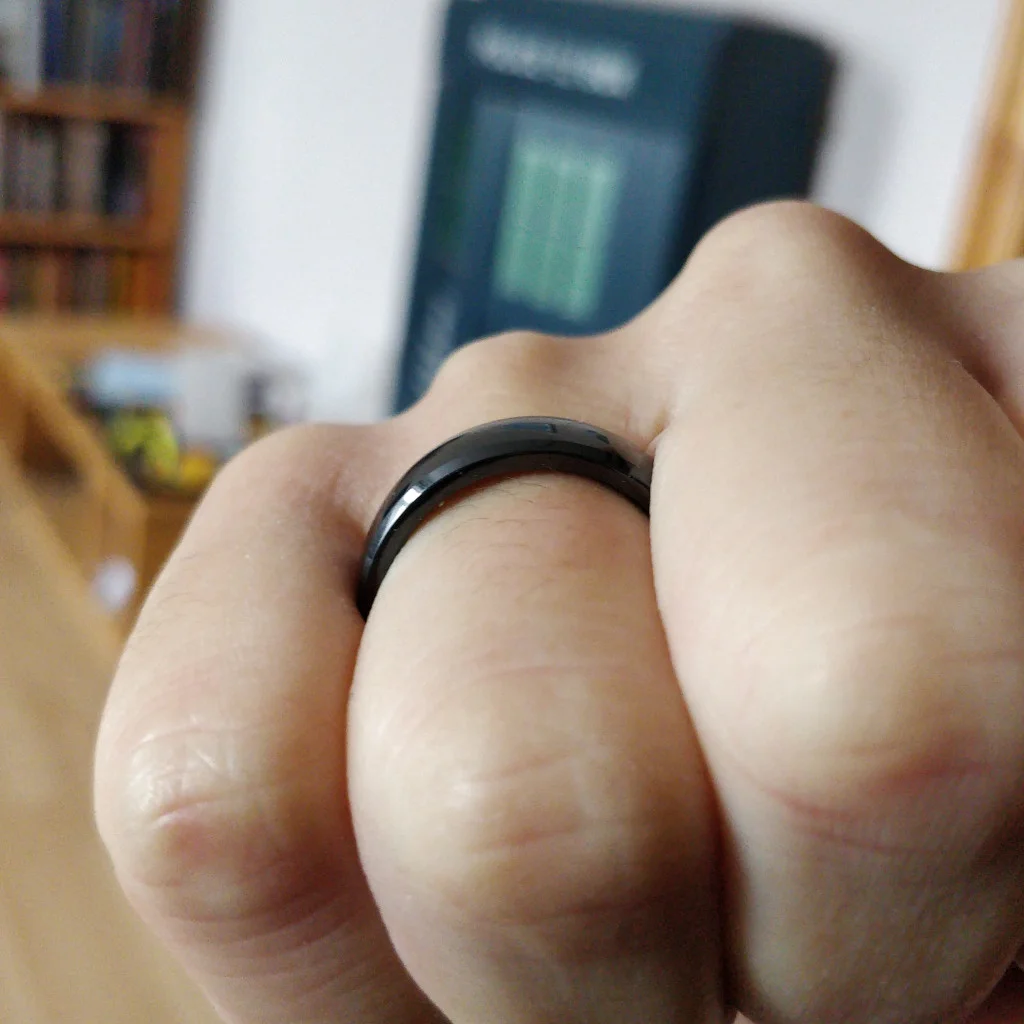 Photo of my fingers curled up so you can see the height of the ring.