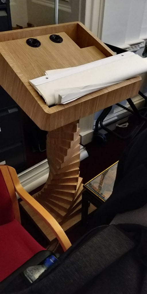 A lectern with a twisted base.