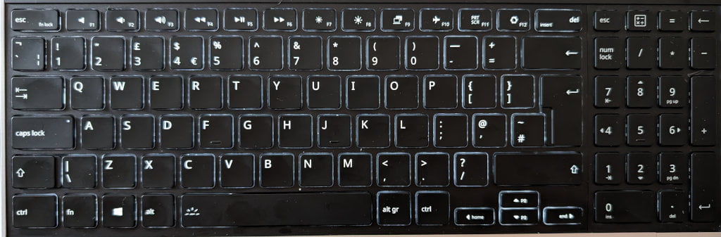 Photo of the keyboard. The numpad is unlit but the main keyboard is illuminated.