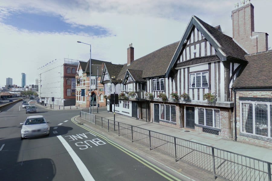 Old style pub on a modern street.