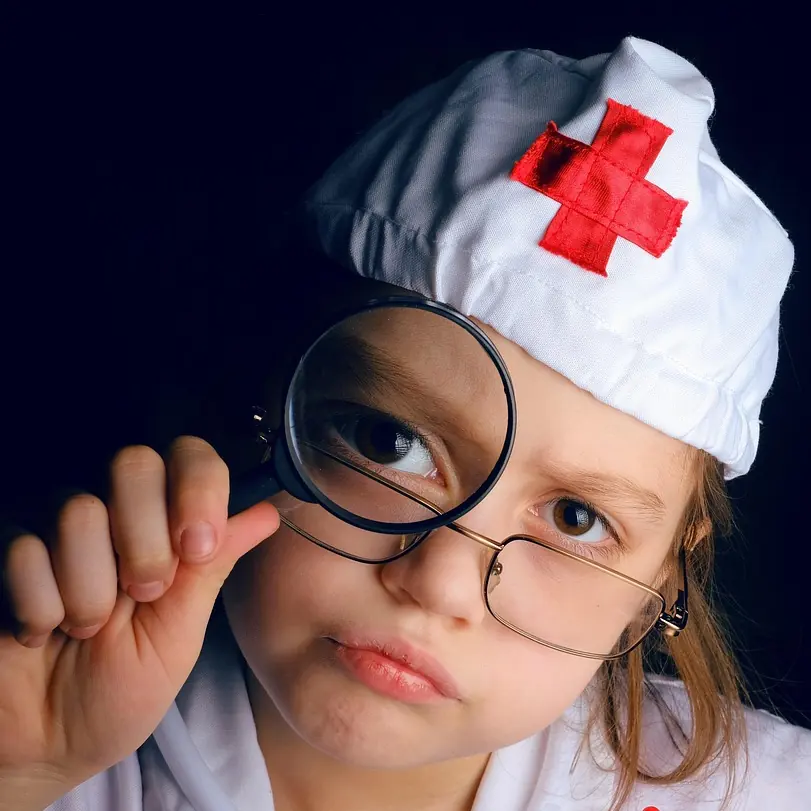 A young child dressed as a doctor. Image by Владимир Берзин from Pixabay.