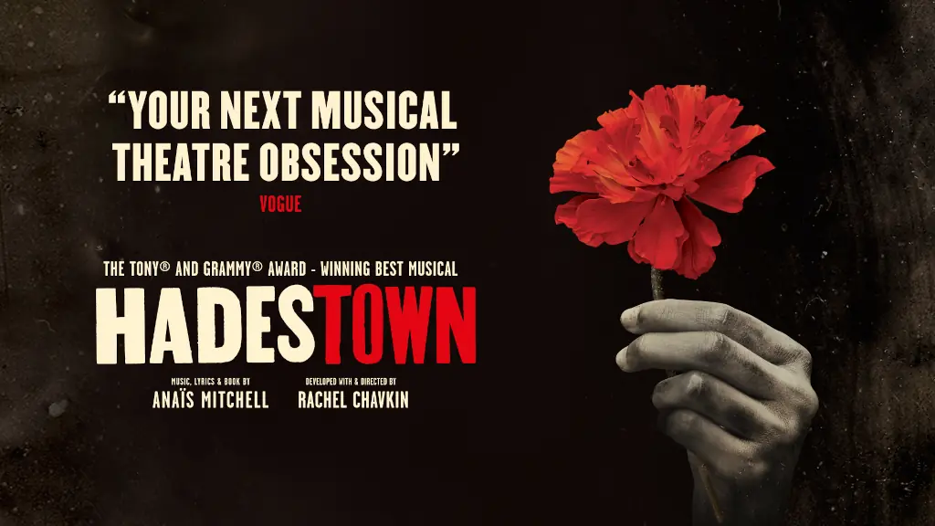 Poster for Hadestown featuring a hand holding a budding flower.