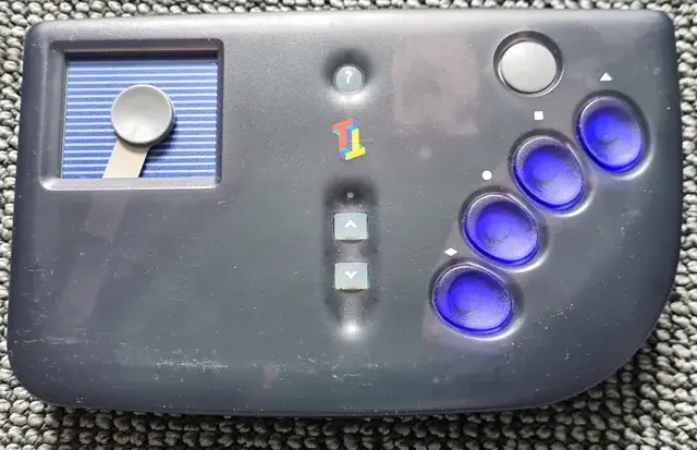 Game controller. Four blue buttons and a primitive touch screen with a blue background.