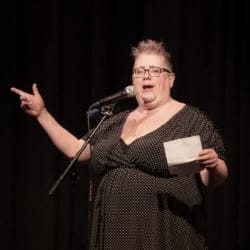 Cameryn Moore at a microphone.