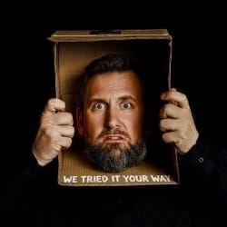 Man's head in a box.
