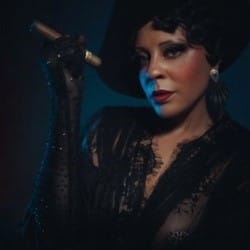 A sultry woman with a cigarette holder.