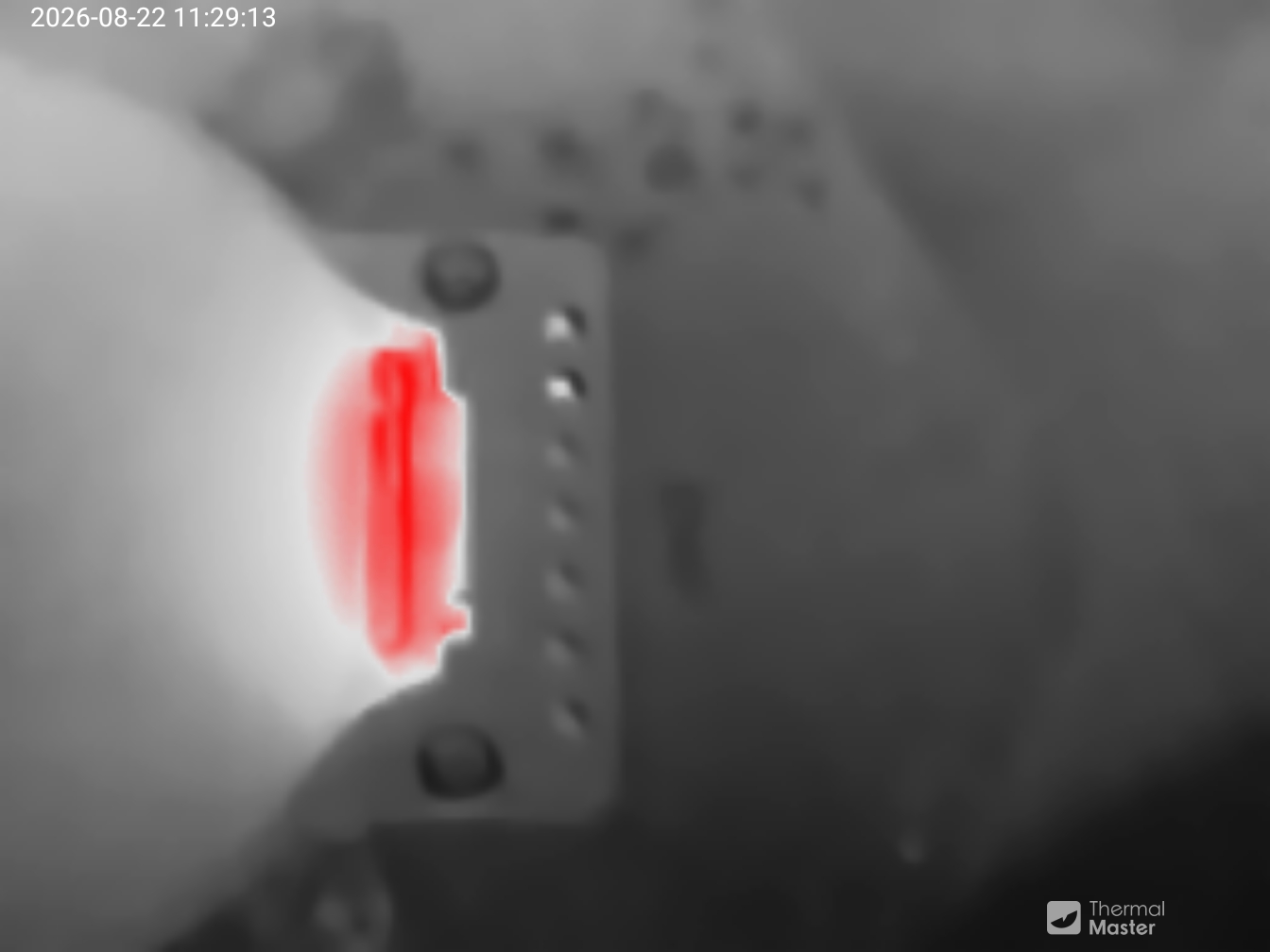 A circuit rendered in grey with a bright red line on it.