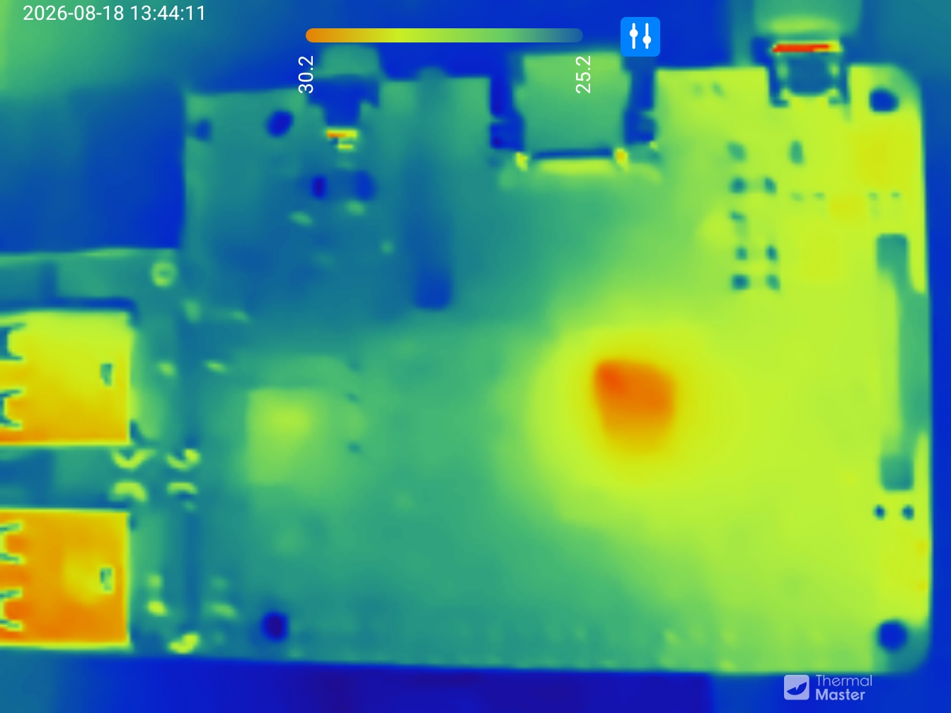 A thermal image of a raspberry pi. The CPU is in red while the rest of the board is green.