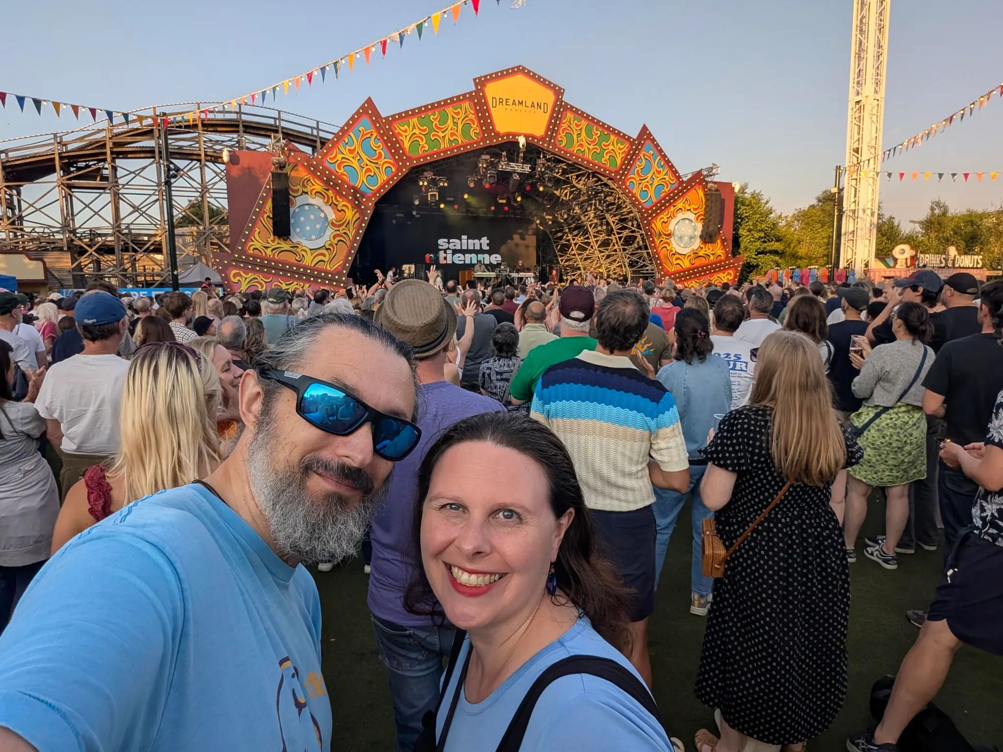 Terry and Liz standing in front of a stage.