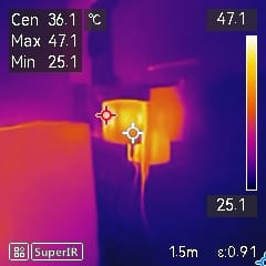 Thermal image with heat data on screen.
