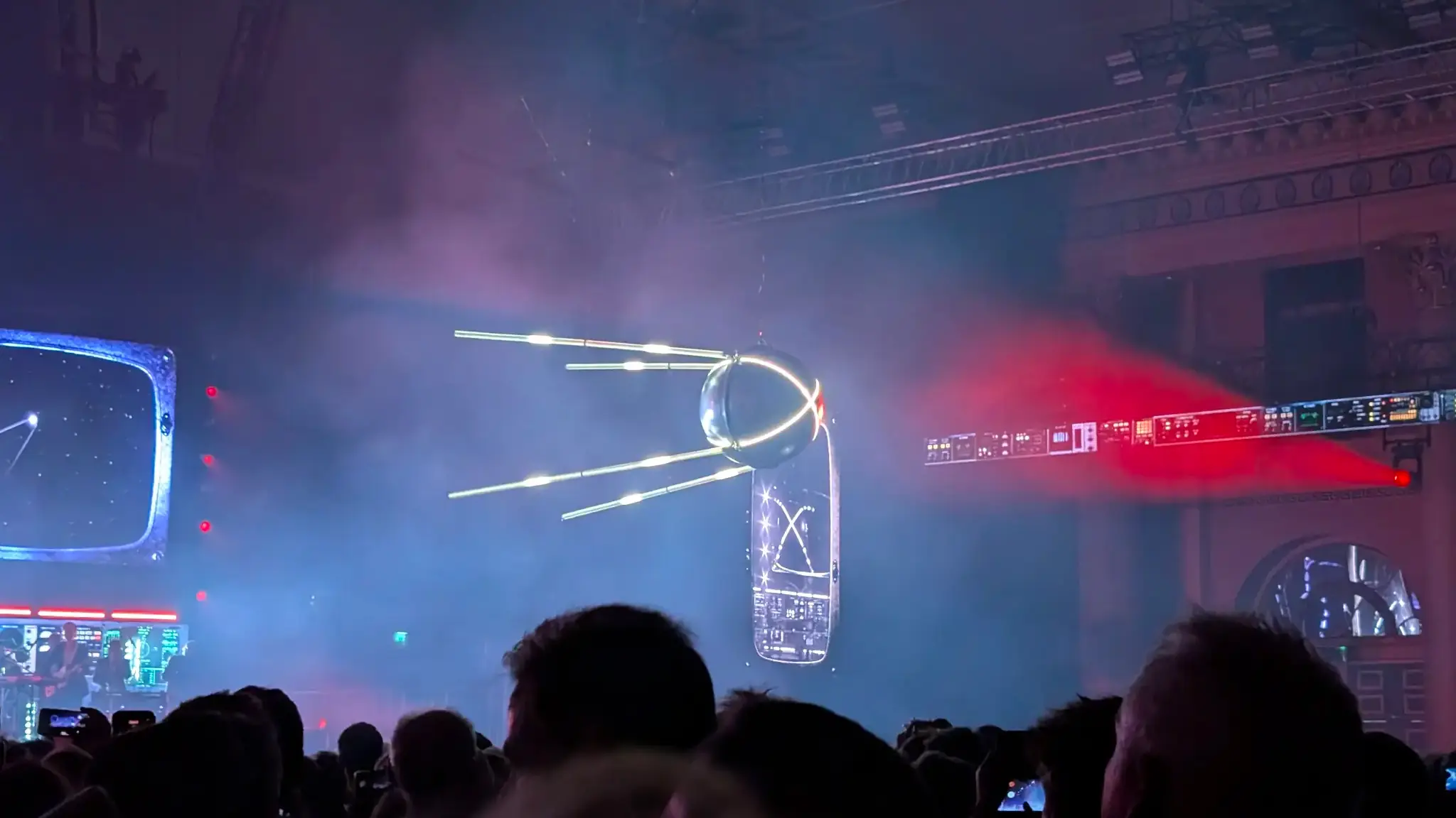 A large model Sputnik covered in lights.
