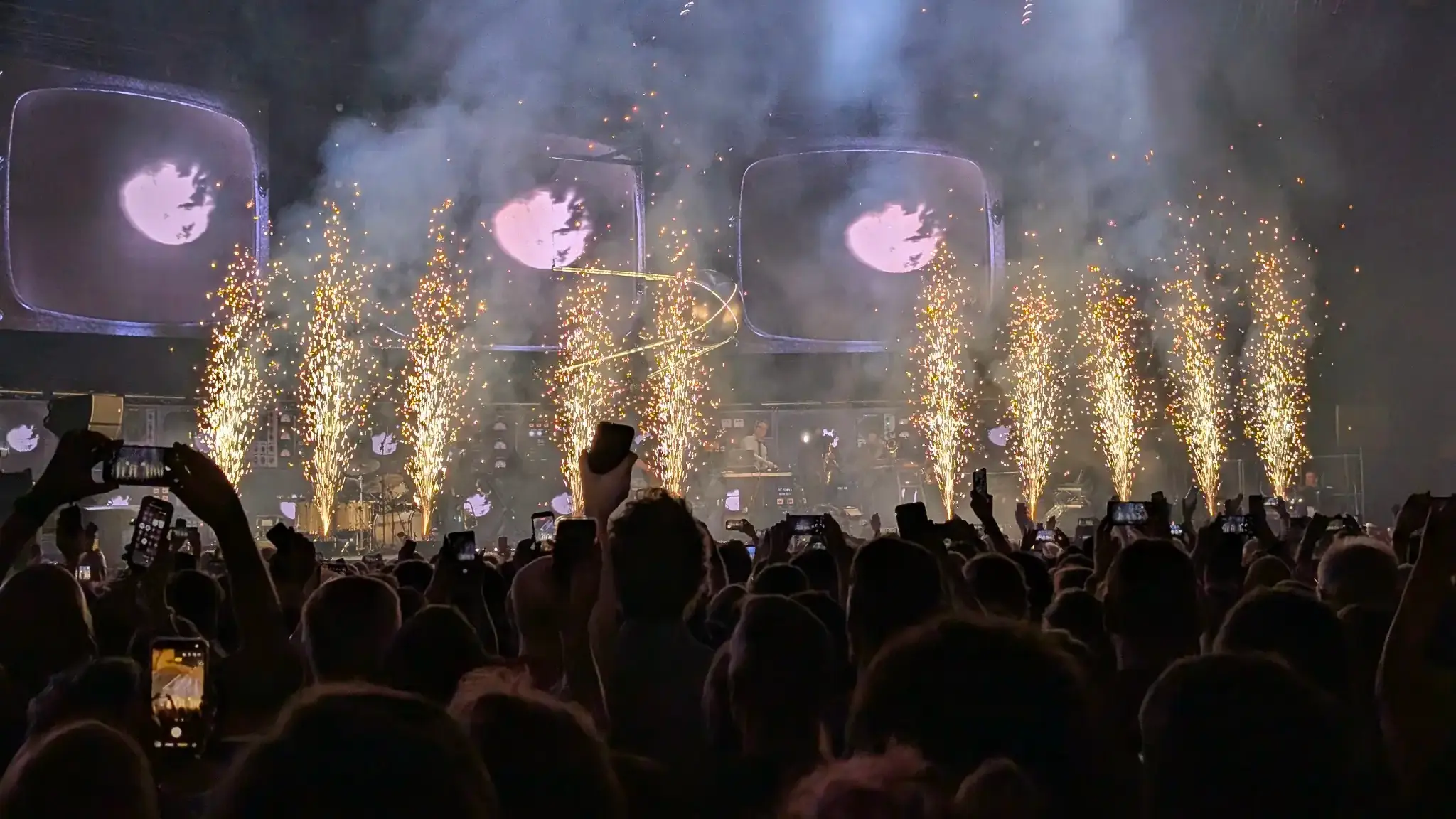 Sparks shooting upwards from the stage.